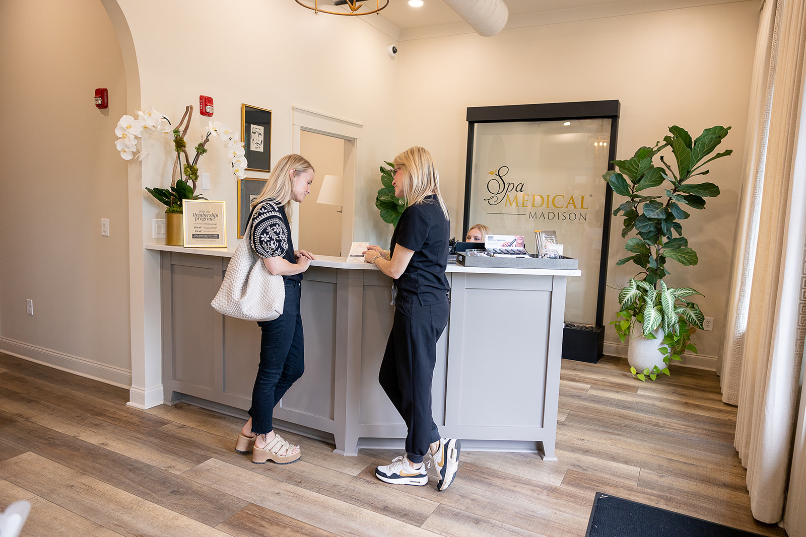 Patient/Doctor discussion at reception of our Madison location.
